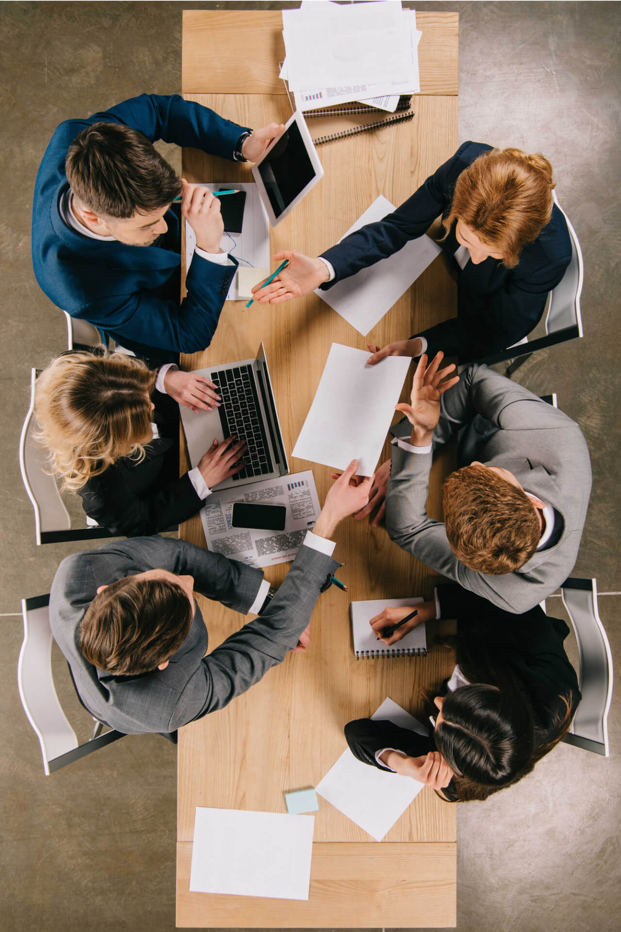 A top view of working employees are working on an IT project